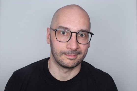 Björn Schulze looking into the camera.